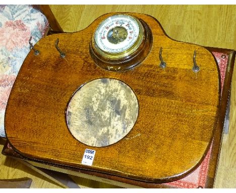 A vintage oak framed wall mounting barometer brush set, 38cm high x 47cm wide