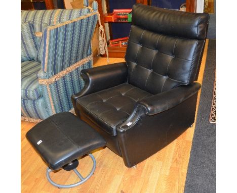 A vintage black reclining armchair by Cornwell Norton for Parker Knoll, 98cm high, with footstool (2)