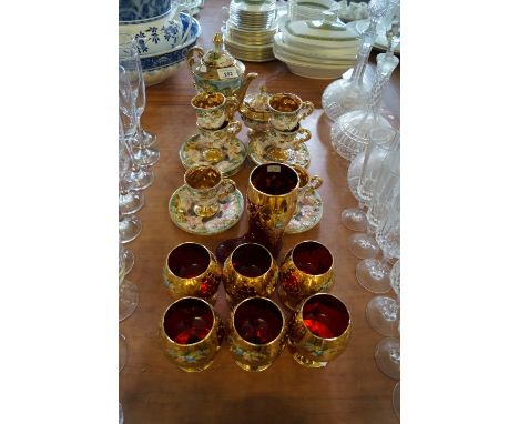 A Capodimonte fourteen piece coffee service for six settings, together with a set of six Venetian enamelled and gilded ruby g