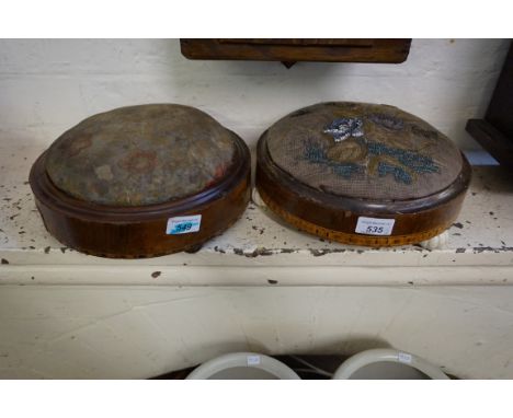Two Victorian parquetry inlaid walnut veneered circular footstools, each with upholstered circular seats, one raised on flute