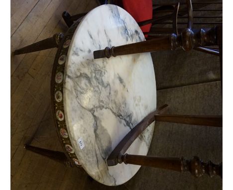 A classical revival low circular occasional table with marble top above a gilded and ceramic mounted frieze, raised on four f