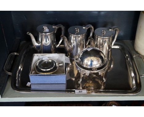 A selection of silver-plate, to include twin handled tea tray, set of three Walker & Hall teapots, a revolving butter dish an