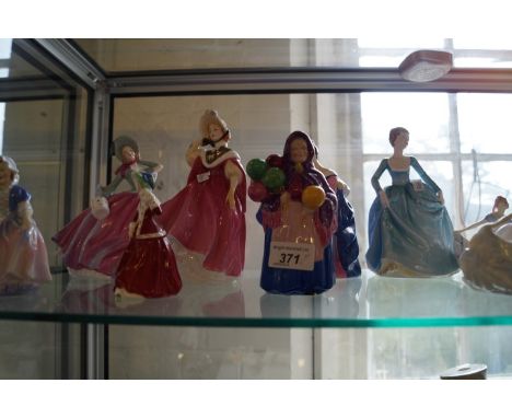 A collection of seven various Royal Doulton lady figurines to include two examples of pretty ladies, together with a W H Goss