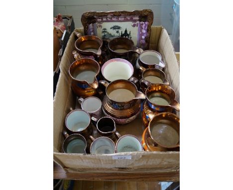 Sixteen pieces of 19th Century lustre pottery including a Sunderland plaque depicting figures before Abbey ruins. CONDITION R