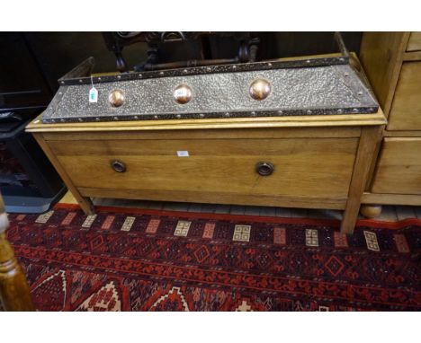 An early 20th Century light oak blanket chest, with one long deep drawer with twin brass drop ring handles, raised on plain s