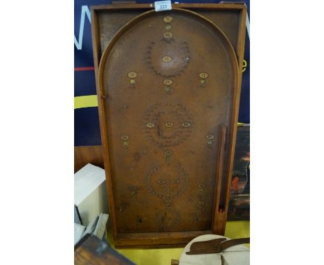 A vintage bagatelle board.