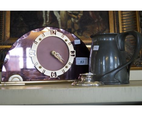 An Art Deco metal mounted faceted coloured glass mantel clock, an Art Nouveau tudric pewter tankard no '066', a small damaged