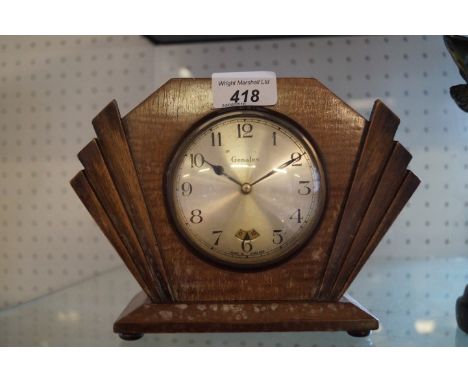 An Art Deco Genalex fifty cycle mantel clock.