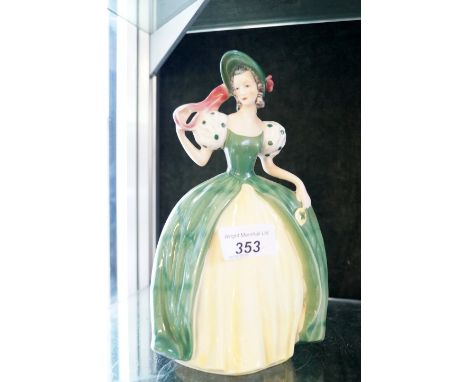A Goebel, German ceramic model of a lady in a green dress.