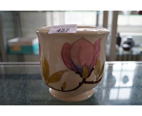 A Moorcroft Magnolia pattern planter on a cream ground.
