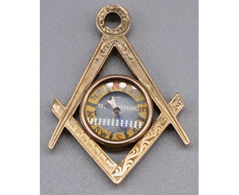 10c gold Masonic Square and Compass fob pendant with working compass, marked 10c, L3.5cm, 4.1g gross 