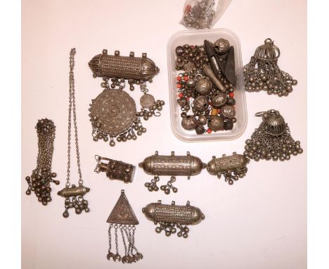 Middle Eastern tribal Yemeni/Omani white metal wedding type jewellery: four hirz amulet pendants, all with applied decoration
