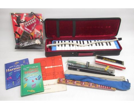 Cased Gremlin blue key melodica, Johnson harmonica, 2 flutes, a penny whistle, Feadog irish whistle, Acme song whistle, TOMY 