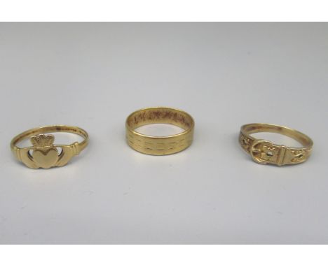 9ct yellow gold Claddagh ring, size R, a 9ct ring in the form of a belt, size N, and a 9ct gold band ring with engraved patte