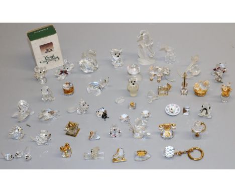 Large collection of Swarovski Crystal glass ornaments, including: cactus; coffee grinder; globe; telephone; pull along bear; 