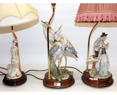 Two Capodimonte Giuseppe Armani composition table lamps, including one modelled as two herons, and a similar table lamp by A 