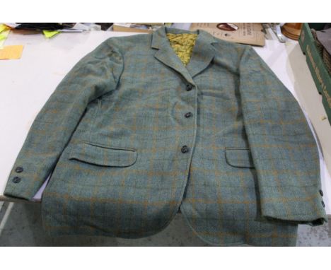 Haggar silk lined tweed jacket with single breast, outside breast pocket with flaps and two outer pockets, three buttons, siz