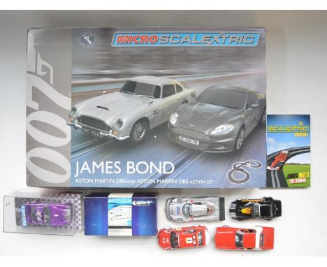 Boxed 1/64 scale Micro Scalextric G1122 James Bond Aston Martin DB5 and DBS Action set, excellent little used condition with 