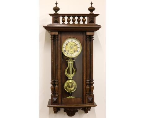 C20th continental walnut Vienna quarter striking wall clock, moulded case with spindle gallery and turned finials over full l