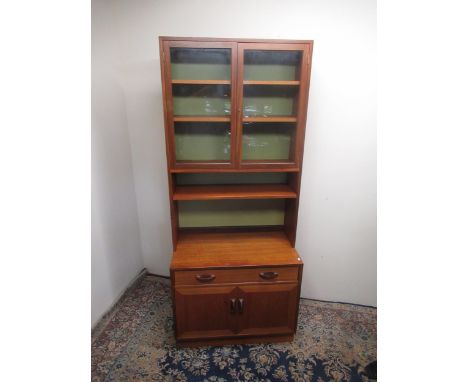 G-Plan narrow two section lounge unit, two glazed doors over open shelf, single drawer and two cupboard doors W84cm D46cm H19