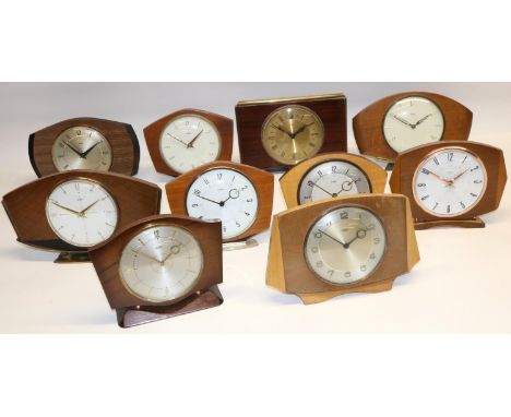 1950's Metamec 30 hour formica veneered mantle clock, silvered dial on turned brass feet W21cm and nine other Metamec 30 hour