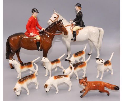 Beswick hunting figures: standing huntsman on bay horse, huntswoman on dapple grey horse, fox, and seven fox hounds (10) 