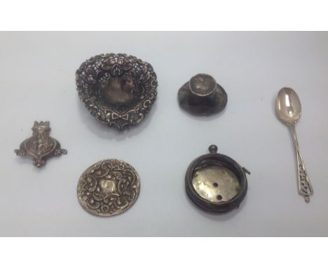 Silver including a top hat, embossed pin dish, fob watch casing, teaspoon and rattle handle, gross weight approx. 2.76 ozt, t