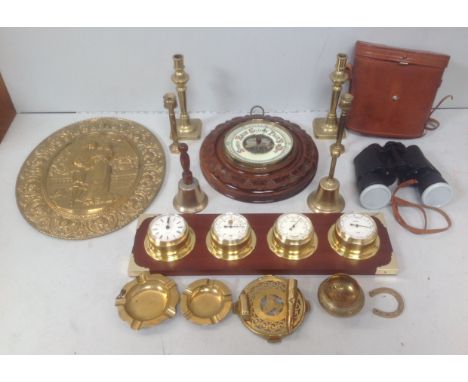 A mixed lot including an aneroid barometer mounted on circular carved wooden plinth, a Staiger four piece brass set of clock,