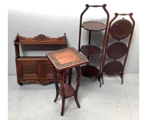 A stained oak jardiniere stand / occasional table carved with foliate frieze to top, together with a hanging shelf with open 