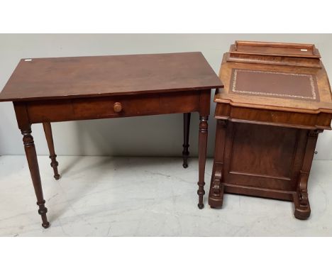 A Victorian walnut Davenport with gilt tooled brown leather scribe opening to reveal compartment with two drawers, rear compa