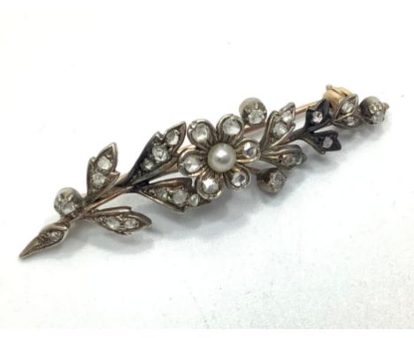 An Edwardian gold, diamond and seed pearl floral spray brooch, not hallmarked but tests as 9ct gold, 4.4g 