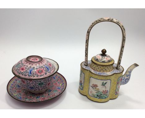 A Chinese Ch'ien Lung style enamel-on-copper teapot, of lotus shape with loop handle, delicately painted with panels of birds