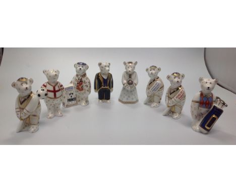 Eight Royal Crown Derby paperweights, 'It's a Prince Newspaper Seller', limited edition 155/1000, 'England Footballer Bear', 