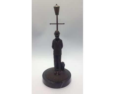 Paul Horton (contemporary), 'The Longest Of Days', bronze sculpture of a man with patched clothing leaning back on to a lamp 