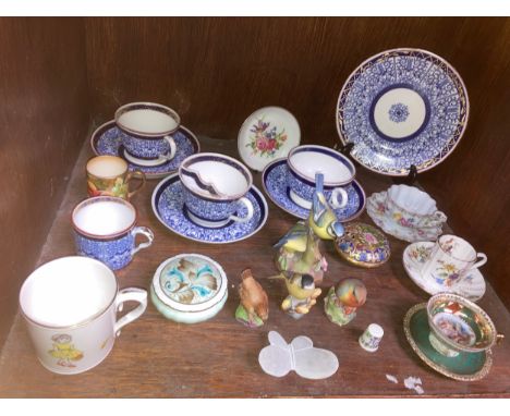 A Royal Worcester 'Royal Lily' pattern his-and-hers tea cup, moustache cup and saucers, a trio in the same pattern, together 