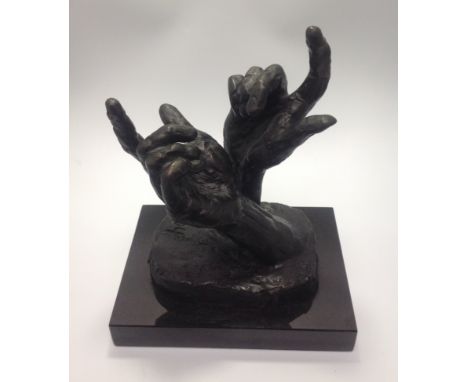 Rolf Harris (1931-), 'Intuition', a bronze sculpture of two hands (modelled on his daughter Bindi's hand, recast and placed a