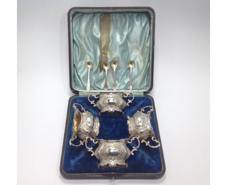 A cased set of four Edwardian silver salts, Walker &amp; Hall, of two-handled oval form embossed with rococo decoration, thre