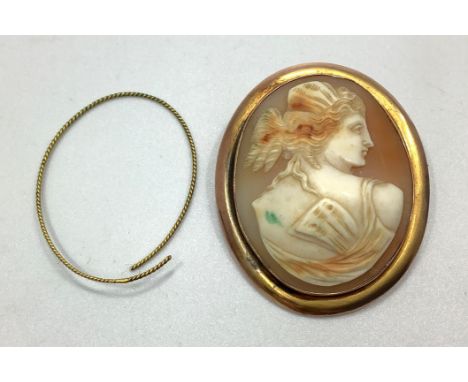 A yellow gold shell carved cameo brooch, tests as better than 14ct, carved with a female with ringlets facing right, gross we