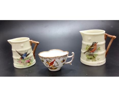 Two various early 20th century Royal Worcester porcelain jugs painted with a chaffinch and a swallow, both signed by William 