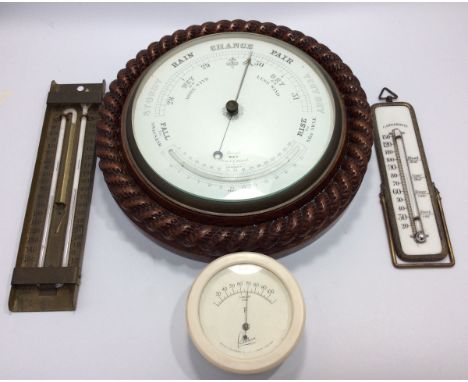 A circular aneroid barometer with wooden rope twist circular plaque, together with a thermometer by G H Zeal, an easel thermo