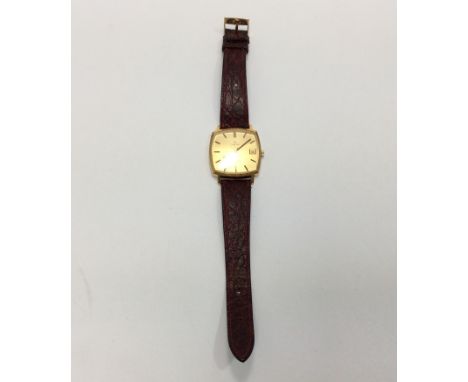 A gold-plated Omega Geneve wristwatch, the squared gilt dial with batons denoting hours and date aperture at 3 o'clock positi