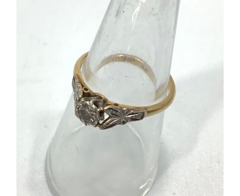 An 18ct gold solitaire diamond ring, with a small diamond in a claw setting, estimated weight of diamond 0.20cts, weighs 2.6 