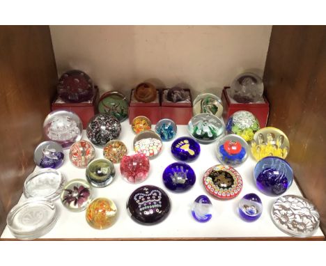 Thirty two various glass paperweights including Caithness 'Heart of Gold', Golden Jubilee Tribute limited edition 192/500, Mo