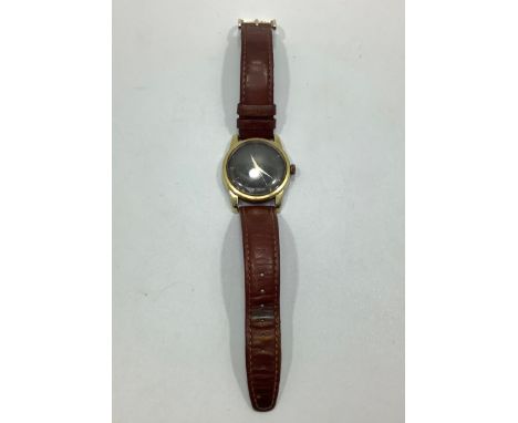 A gents gold-plated Omega Seamaster automatic wristwatch, the black crosshair dial with batons denoting hours, Arabic numeral