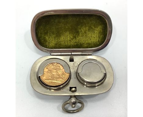 A 22ct gold George V 1912 Sovereign weighing 8.0 grams, in white metal double coin holding case. 