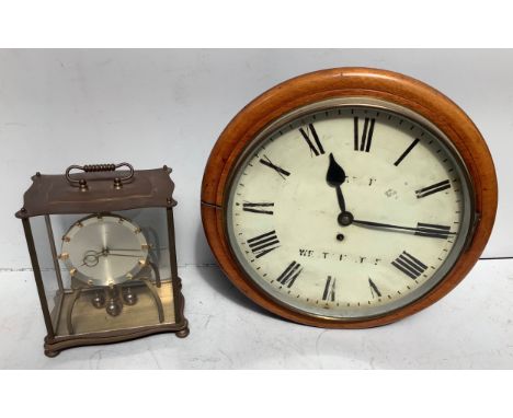 A 19th century wooden cased circular wall clock with fusee movement, cream enamel dial, black Roman numerals, wording worn, l