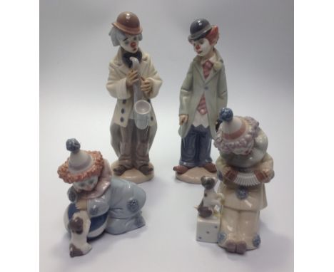 Four various Lladro porcelain Clown / Pierrot figures including 'Pierrot with Puppy &amp; Ball' No. 5278, 'Pierrot with Conce
