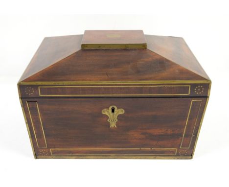 Early 19th century mahogany brass mounted tea caddy of sarcophagus form with partitioned interior concealing drawer to side a