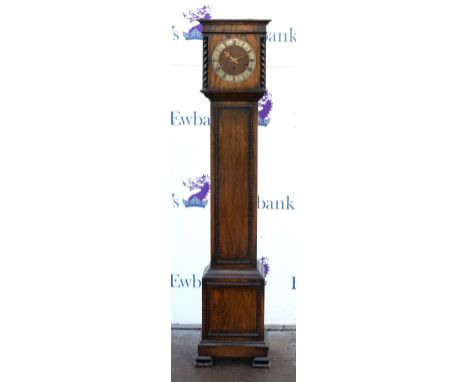 19th century oak grandmothers clock with three train movement and brass weathered face with barley twist supports on ogee bra