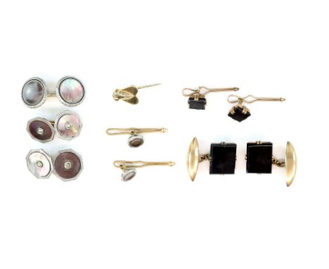 A group of cufflinks and shirt studs, including one pair of rectangular cut onyx panel cufflinks and a pair of matching studs